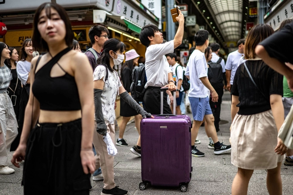 People visit the Asakusa district near Sensoji Temple, a popular tourist location, in Tokyo on Sept. 7. People visit the Asakusa district near Sensoji Temple, a popular tourist location, in Tokyo on Sept. 7.