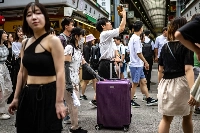 People visit the Asakusa district near Sensoji Temple, a popular tourist location, in Tokyo on Sept. 7. | AFP-JIJI