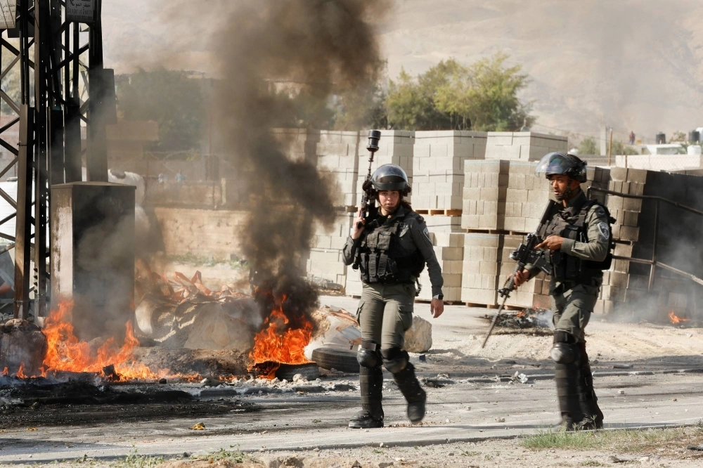 Israeli soldiers clash with Palestinians during a raid into Jericho in the Israeli-occupied West Bank in March. Israeli soldiers clash with Palestinians during a raid into Jericho in the Israeli-occupied West Bank in March.