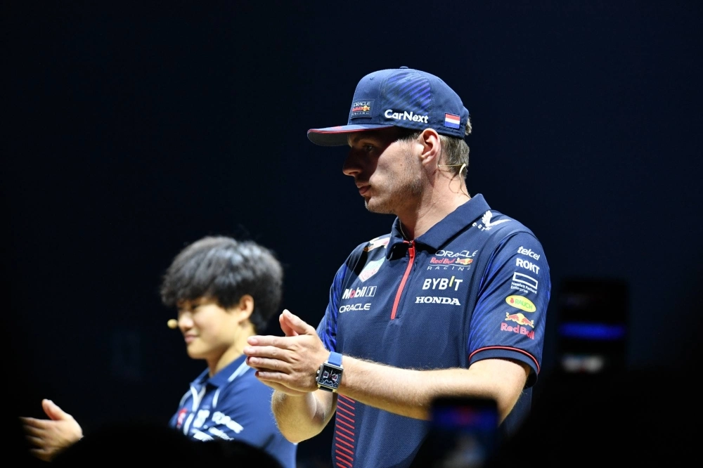 Red Bull's Max Verstappen (right) and AlphaTauri's Yuki Tsunoda take part in a fan event in Tokyo on Wednesday, ahead of the Japanese Grand Prix in Suzuka, Mie Prefecture, at the weekend. Red Bull's Max Verstappen (right) and AlphaTauri's Yuki Tsunoda take part in a fan event in Tokyo on Wednesday, ahead of the Japanese Grand Prix in Suzuka, Mie Prefecture, at the weekend.