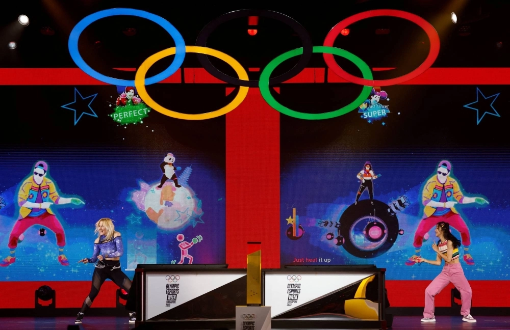 Players compete against one another during the Just Dance event at the Olympic Esports Week in Singapore in June. Players compete against one another during the Just Dance event at the Olympic Esports Week in Singapore in June.