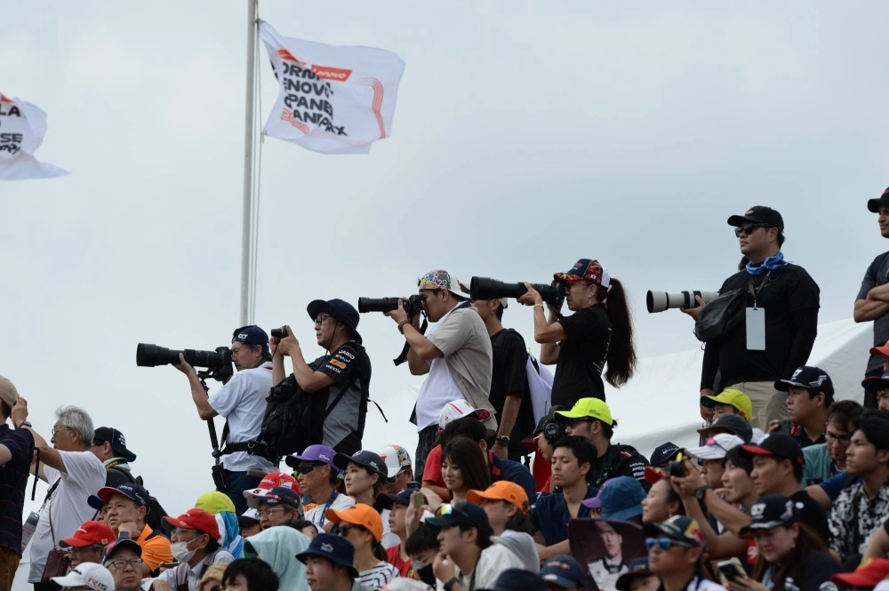 Fans shoot Friday's second practice session at Suzuka Circuit. Fans shoot Friday's second practice session at Suzuka Circuit.