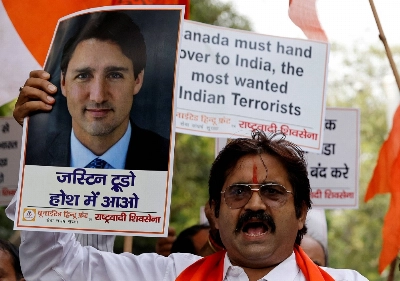 United Hindu Front activists protest in New Delhi on Sunday over Canadian Prime Minister Justin Trudeau's allegations of Indian involvement in the assassination of a Sikh independence proponent back in Canada. United Hindu Front activists protest in New Delhi on Sunday over Canadian Prime Minister Justin Trudeau's allegations of Indian involvement in the assassination of a Sikh independence proponent back in Canada.