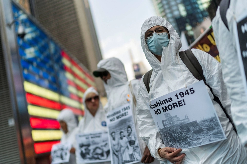 Anti-war demonstrators mark the 78th anniversary of the United States' 1945 atomic bomb attack on Hiroshima with a march and protest in New York's Times Square on Aug. 6. Anti-war demonstrators mark the 78th anniversary of the United States' 1945 atomic bomb attack on Hiroshima with a march and protest in New York's Times Square on Aug. 6.