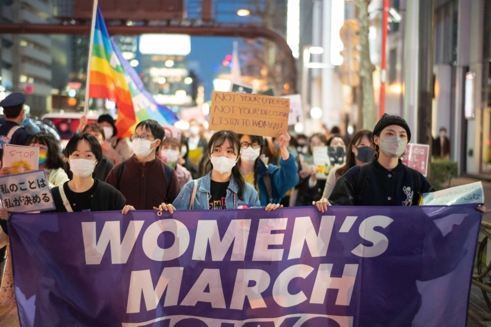 Demonstrators during a Women's Day march in Tokyo on March 8 Demonstrators during a Women's Day march in Tokyo on March 8