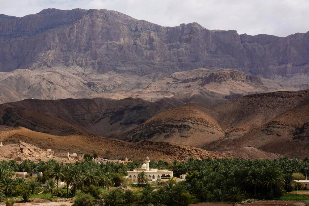 A mosque is seen against a backdrop of the Al Hajar Mountains near Al Ayn, Oman. A mosque is seen against a backdrop of the Al Hajar Mountains near Al Ayn, Oman.