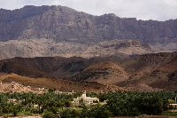 A mosque is seen against a backdrop of the Al Hajar Mountains near Al Ayn, Oman. | REUTERS