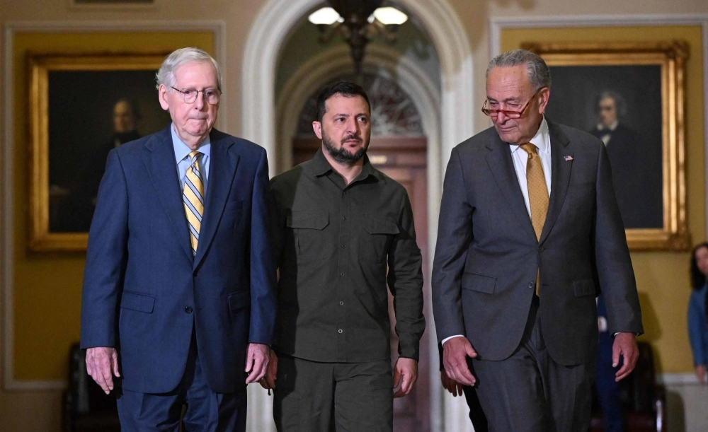 Ukrainian President Volodymyr Zelenskyy is accompanied by U.S. Senate Majority Leader Chuck Schumer and Senate Minority Leader Mitch McConnell in the Old Senate Chamber, at the U.S. Capitol in Washington on Sept. 21. Ukrainian President Volodymyr Zelenskyy is accompanied by U.S. Senate Majority Leader Chuck Schumer and Senate Minority Leader Mitch McConnell in the Old Senate Chamber, at the U.S. Capitol in Washington on Sept. 21.