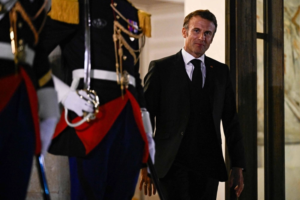 French President Emmanuel Macron arrives to greets Finland's Prime Minister at the Elysee Palace in Paris on Wednesday. French President Emmanuel Macron arrives to greets Finland's Prime Minister at the Elysee Palace in Paris on Wednesday.