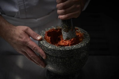Ayatana's hand-pounded curry paste is just one example of what chef Bo Songvisava calls her revival of traditional Thai cuisine. Ayatana's hand-pounded curry paste is just one example of what chef Bo Songvisava calls her revival of traditional Thai cuisine.