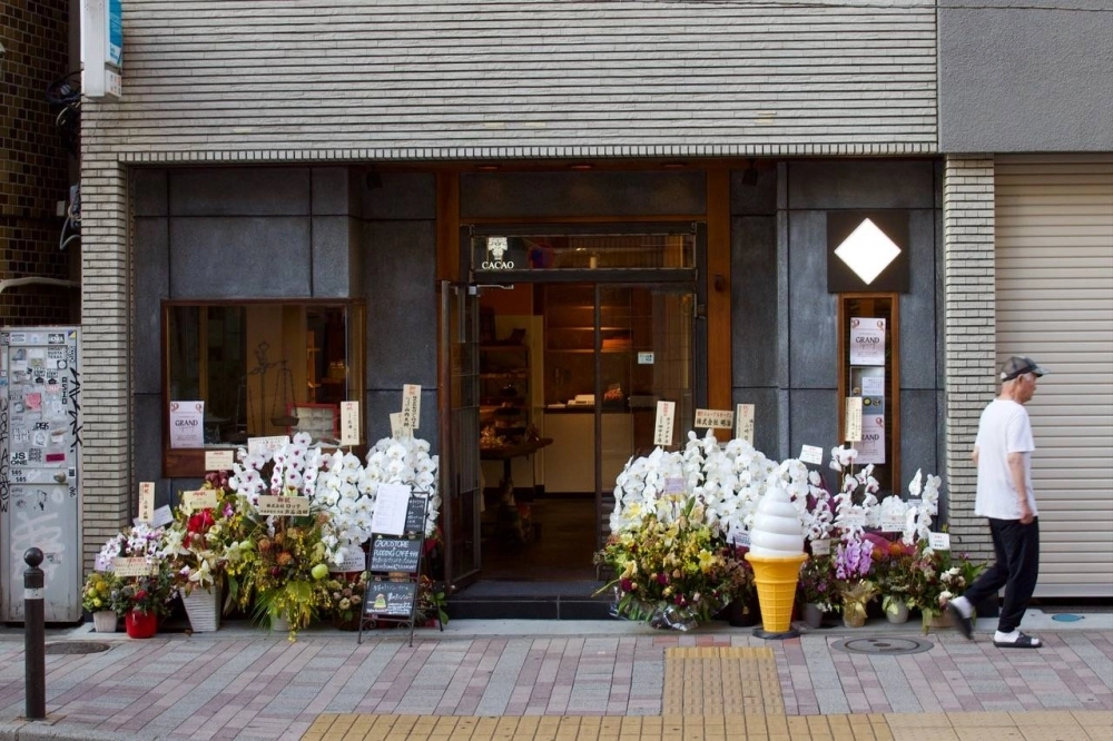 Orchids outside a shop in Tokyo during its grand opening. Orchids are common business gifts throughout Asia. Orchids outside a shop in Tokyo during its grand opening. Orchids are common business gifts throughout Asia.