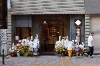 Orchids outside a shop in Tokyo during its grand opening. Orchids are common business gifts throughout Asia. | Elizabeth Beattie