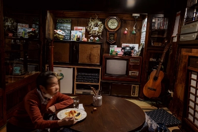 A woman takes her meal alone in Tokyo's Yanaka neighborhood. As the country ages, Japan's average caloric intake has been shrinking.  A woman takes her meal alone in Tokyo's Yanaka neighborhood. As the country ages, Japan's average caloric intake has been shrinking.