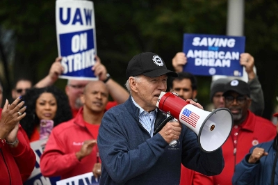 U.S. President Joe Biden joins members of the United Auto Workers union as they strike in Belleville, Michigan, on Sept. 26 to demand higher wages. U.S. President Joe Biden joins members of the United Auto Workers union as they strike in Belleville, Michigan, on Sept. 26 to demand higher wages.