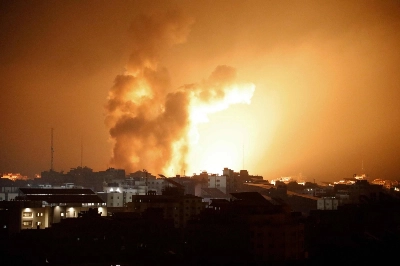 Fire and smoke rises above buildings during an Israeli airstrike in Gaza City, in the Gaza Strip, on Sunday.  Fire and smoke rises above buildings during an Israeli airstrike in Gaza City, in the Gaza Strip, on Sunday.