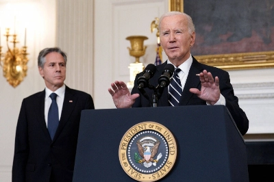 U.S. President Joe Biden speaks in the State Dining Room of the White House in Washington, on Saturday, as Secretary of State Antony Blinken listens. U.S. President Joe Biden speaks in the State Dining Room of the White House in Washington, on Saturday, as Secretary of State Antony Blinken listens.
