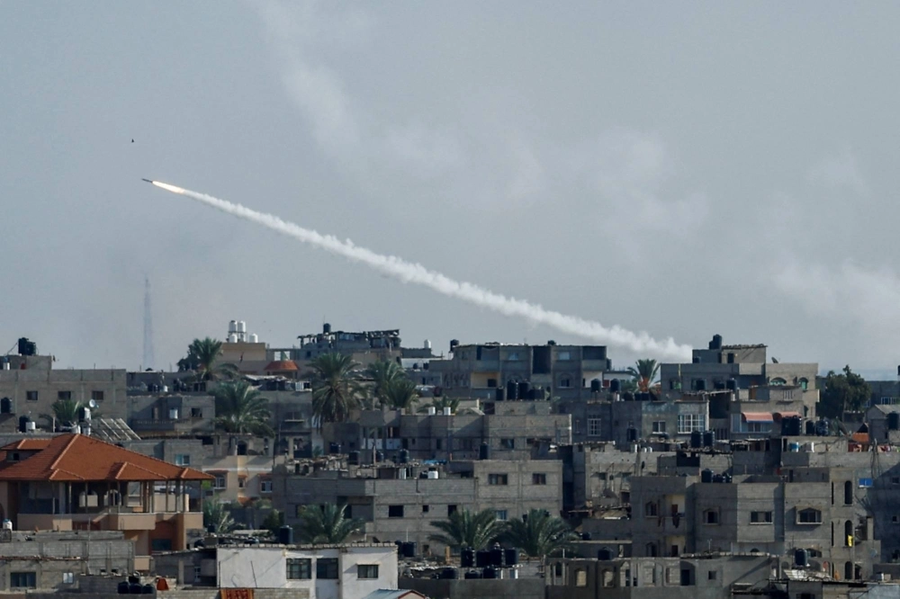 A rocket is fired from Gaza toward Israel on Saturday  A rocket is fired from Gaza toward Israel on Saturday
