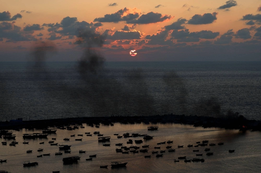 Smoke rises after Israeli strikes on the seaport of Gaza City on Tuesday. Smoke rises after Israeli strikes on the seaport of Gaza City on Tuesday.