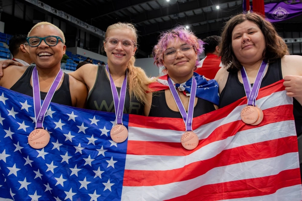 U.S. wrestlers (from left) Christina Griffin, Madison Guinn, Etan Perez and Kellyann Ball celebrate after winning bronze in the women's team competition at the Sumo World Championships in the western Tokyo city of Tachikawa on Sunday. U.S. wrestlers (from left) Christina Griffin, Madison Guinn, Etan Perez and Kellyann Ball celebrate after winning bronze in the women's team competition at the Sumo World Championships in the western Tokyo city of Tachikawa on Sunday.