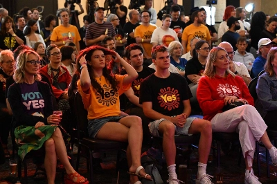 Supporters of the "Yes" vote listen to the results of the referendum on whether to officially recognize Australia's Indigenous peoples, at an event in Sydney on Saturday.  Supporters of the "Yes" vote listen to the results of the referendum on whether to officially recognize Australia's Indigenous peoples, at an event in Sydney on Saturday.