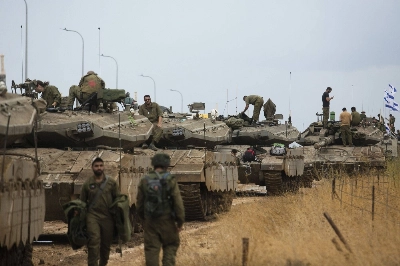 Israeli soldiers organize armored personnel  near the border with Lebanon on Sunday. Israeli soldiers organize armored personnel  near the border with Lebanon on Sunday.