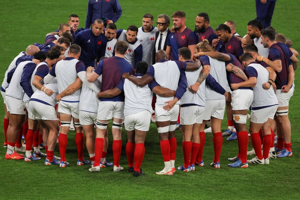 France's head coach Fabien Galthie (top, center) stands with his players ahead of the 2023 Rugby World Cup quarterfinal match between France and South Africa in Saint-Denis, France, on Sunday. France's head coach Fabien Galthie (top, center) stands with his players ahead of the 2023 Rugby World Cup quarterfinal match between France and South Africa in Saint-Denis, France, on Sunday.