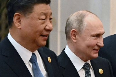 Russian President Vladimir Putin and Chinese leader Xi Jinping head to a group photo session during the third Belt and Road forum at the Great Hall of the People in Beijing on Wednesday. Russian President Vladimir Putin and Chinese leader Xi Jinping head to a group photo session during the third Belt and Road forum at the Great Hall of the People in Beijing on Wednesday.
