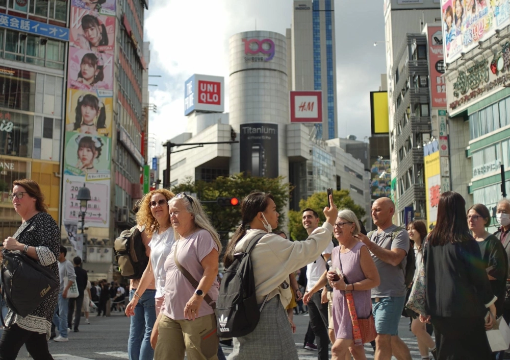 Foreign tourists in Tokyo's Shibuya Ward on Wednesday Foreign tourists in Tokyo's Shibuya Ward on Wednesday