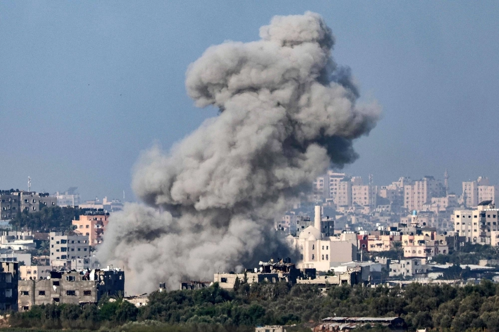 Smoke billows over the northern Gaza Strip during Israeli bombardment on Wednesday.  Smoke billows over the northern Gaza Strip during Israeli bombardment on Wednesday.