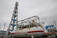 JERA's Hekinan thermal power station in Hekinan, Aichi Prefecture, with an ammonia tank in the foreground. This year, the utility is testing a 20:80 ammonia-to-coal co-firing ratio at the facility.  | Reuters