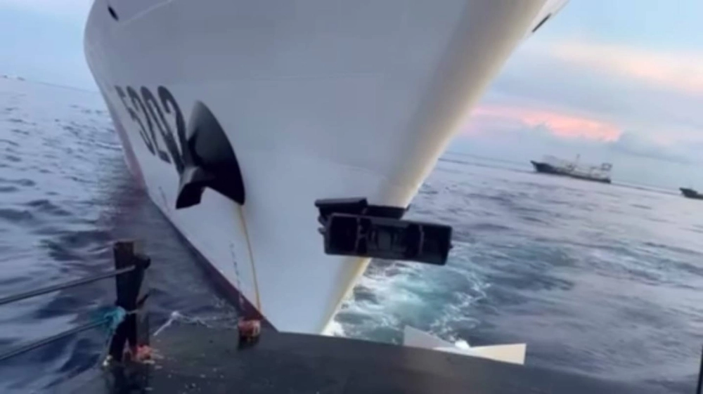 A China Coast Guard vessel collides with a Philippine resupply vessel in the disputed South China Sea on Sunday, in this image taken from video. A China Coast Guard vessel collides with a Philippine resupply vessel in the disputed South China Sea on Sunday, in this image taken from video.