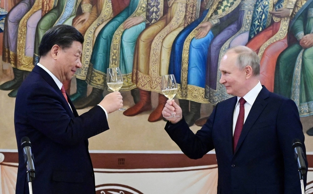 Chinese President Xi Jinping, and his Russian counterpart, Vladimir Putin, make a toast during a reception at the Kremlin in March.   Chinese President Xi Jinping, and his Russian counterpart, Vladimir Putin, make a toast during a reception at the Kremlin in March.