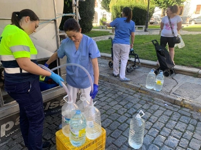 A water company employee fills bottles with potable water in Pozoblanco, Spain, in September 2023. The struggle for drinking water in this village of 18,000 has become a glimpse of what may lie ahead for parts of Europe where drought and extreme heat are on the rise.  A water company employee fills bottles with potable water in Pozoblanco, Spain, in September 2023. The struggle for drinking water in this village of 18,000 has become a glimpse of what may lie ahead for parts of Europe where drought and extreme heat are on the rise.