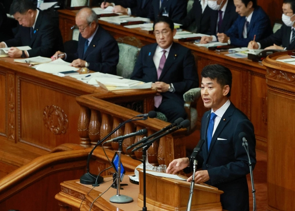 Prime Minister Fumio Kishida listens as Constitutional Democratic Party of Japan chief Kenta Izumi speaks in parliament in Tokyo on Tuesday. Prime Minister Fumio Kishida listens as Constitutional Democratic Party of Japan chief Kenta Izumi speaks in parliament in Tokyo on Tuesday.