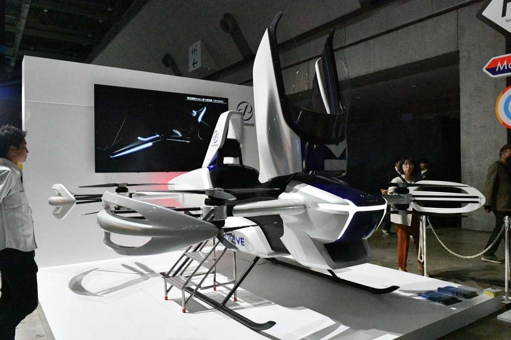SkyDrive displays its eVTOL flying car at the Japan Mobility Show in Tokyo. SkyDrive displays its eVTOL flying car at the Japan Mobility Show in Tokyo.