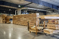 After the boards are pressed, the adhesive has cured and the glulam beams are precision-cut, they’re ready to be shipped to a construction site.  | Bloomberg