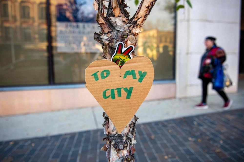 Cardboard hearts with messages are hung in the downtown area in Lewiston, Maine, on Thursday, in the aftermath of a mass shooting. Cardboard hearts with messages are hung in the downtown area in Lewiston, Maine, on Thursday, in the aftermath of a mass shooting.