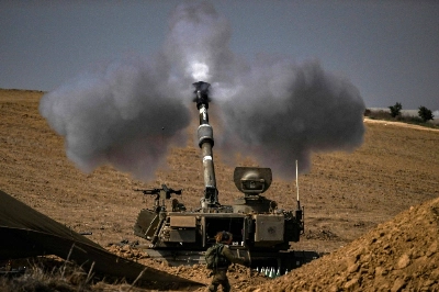 The Israeli military fires shells toward the Gaza Strip on Saturday. The Israeli military fires shells toward the Gaza Strip on Saturday.
