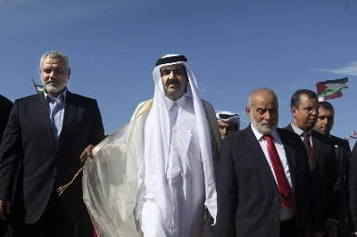 Hamas’ Ismail Haniyeh (left) and the former emir of Qatar arrive at a cornerstone-laying ceremony for the new Hamad residential neighborhood in Gaza in 2012.   Hamas’ Ismail Haniyeh (left) and the former emir of Qatar arrive at a cornerstone-laying ceremony for the new Hamad residential neighborhood in Gaza in 2012.