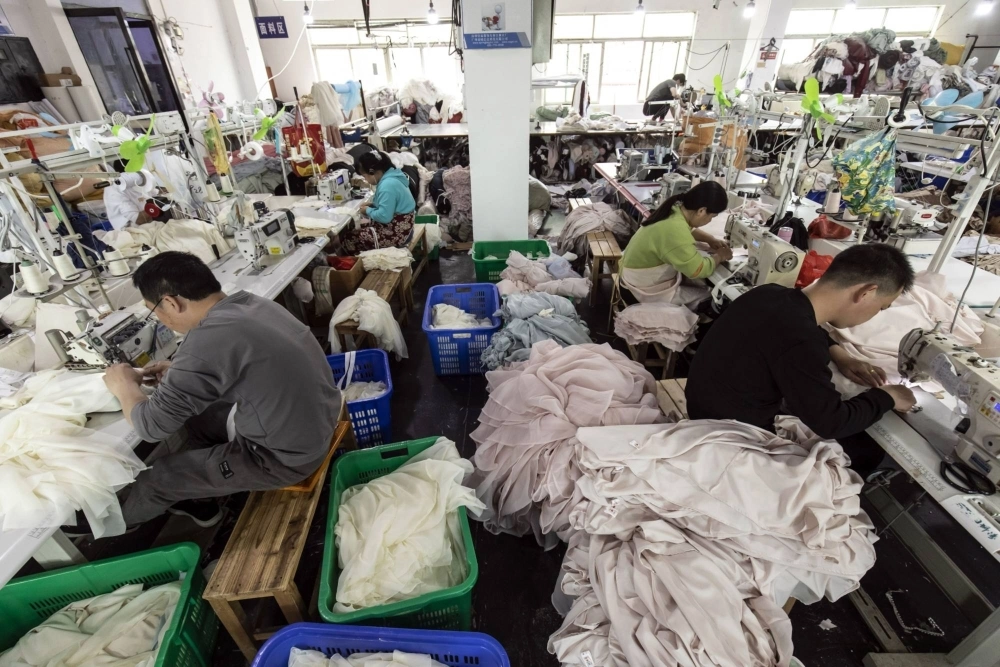 Workers at a garment factory in Guangzhou on Feb. 9 Workers at a garment factory in Guangzhou on Feb. 9