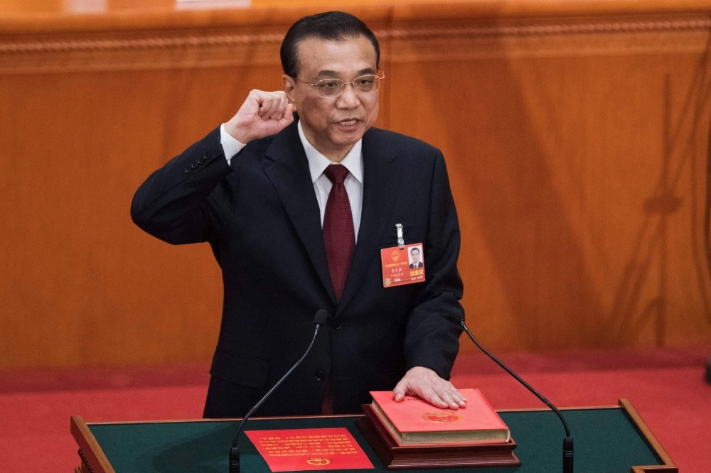 Then-Chinese Premier Li Keqiang takes the oath after he was re-elected for a second term during the sixth-plenary session of the National People's Congress in Beijing in March 2018. Then-Chinese Premier Li Keqiang takes the oath after he was re-elected for a second term during the sixth-plenary session of the National People's Congress in Beijing in March 2018.