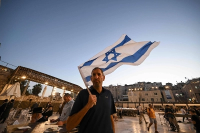 An Israeli man attends a day of prayer in the Old City of Jerusalem on Oct. 19 where attendees called for the safe return of hostages taken by Hamas militants earlier in the month.  An Israeli man attends a day of prayer in the Old City of Jerusalem on Oct. 19 where attendees called for the safe return of hostages taken by Hamas militants earlier in the month.