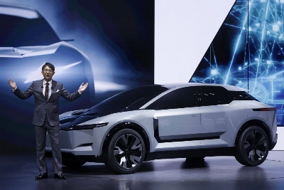 Toyota President Koji Sato speaks  next to an FT-3e electric vehicle at the Japan Mobility Show in Tokyo on Oct. 25. Toyota President Koji Sato speaks  next to an FT-3e electric vehicle at the Japan Mobility Show in Tokyo on Oct. 25.