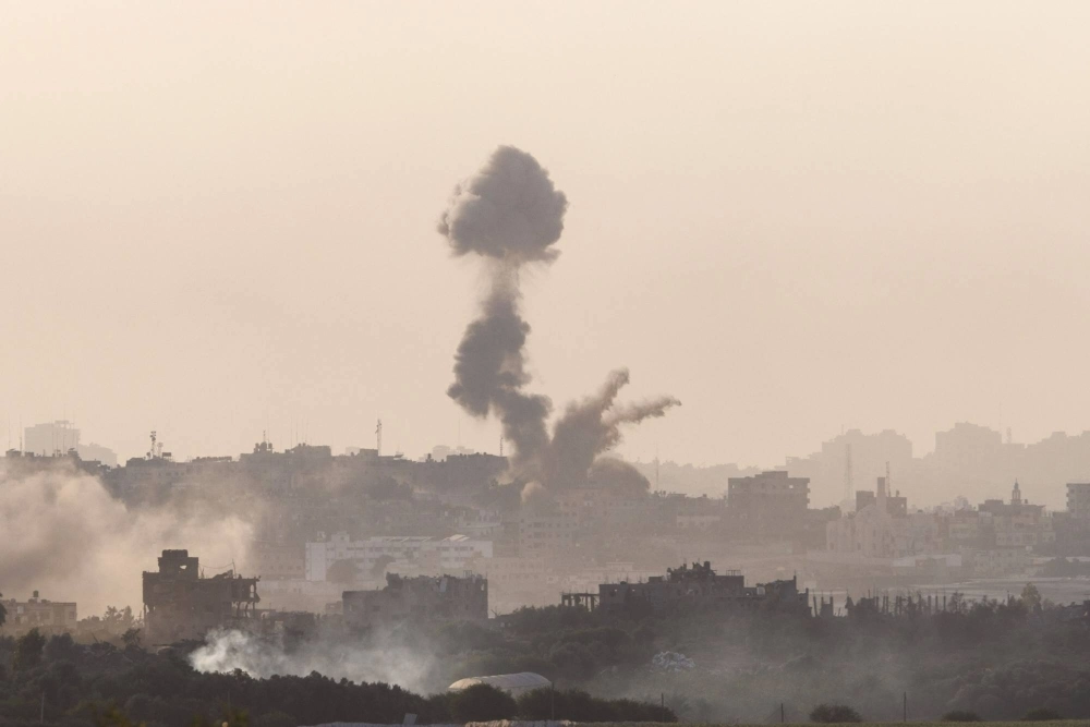 Smoke rises from destroyed buildings in the Gaza Strip following Israeli airstrikes on Monday. Smoke rises from destroyed buildings in the Gaza Strip following Israeli airstrikes on Monday.