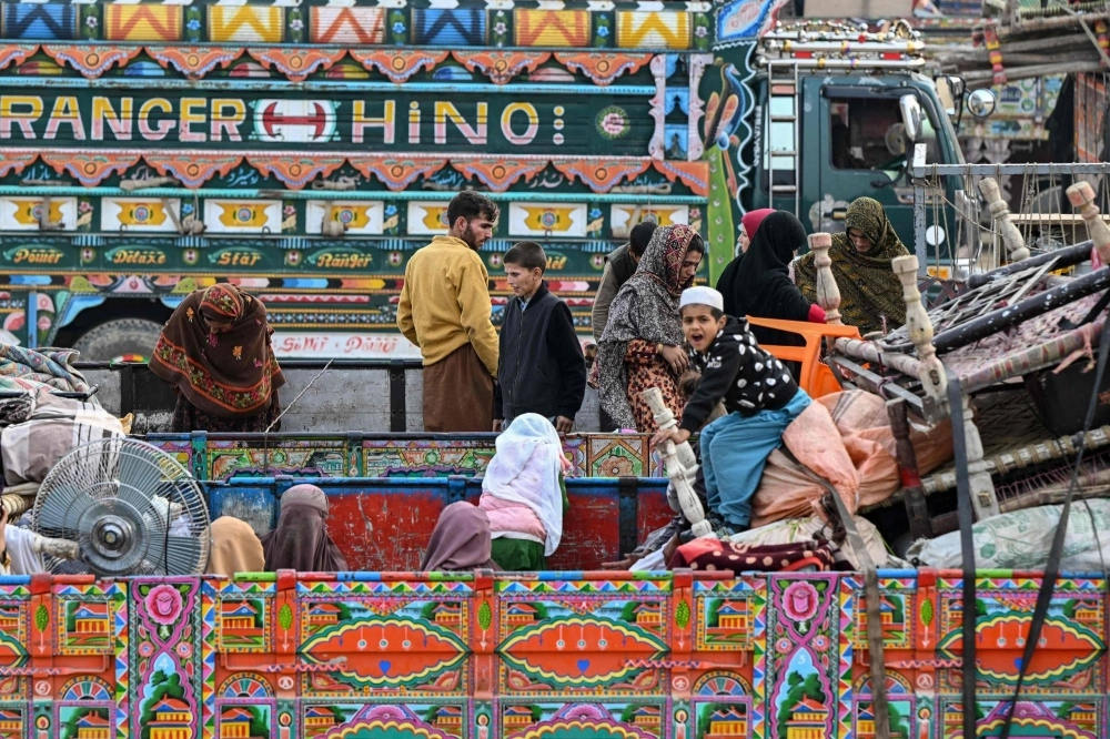 Afghan refugees arrive in a truck at a holding center as they prepare to depart for Afghanistan, in the town of Landi Kotal, Pakistan, on Wednesday. Hundreds of thousands of Afghans living in Pakistan faced the threat of detention and deportation on the day, as a government deadline for them to leave sparked a mass exodus. Afghan refugees arrive in a truck at a holding center as they prepare to depart for Afghanistan, in the town of Landi Kotal, Pakistan, on Wednesday. Hundreds of thousands of Afghans living in Pakistan faced the threat of detention and deportation on the day, as a government deadline for them to leave sparked a mass exodus.