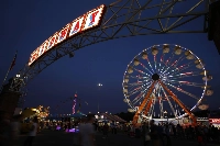 The midway in Springfield, Massachusetts, lit up at night. Framingham, Massachusetts mayor Charlie Sisitsky said its geothermal pilot project could more than halve emissions and cut energy consumption for some properties by up to 70%. | REUTERS