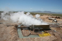 Steam escapes from a well at Raser Technologies' geothermal plant near Minersville, Utah. In April, the U.S. Department of Energy announced the first-ever backing for 11 community geothermal projects in 10 states, while several states have passed new laws to boost the strategy. | REUTERS