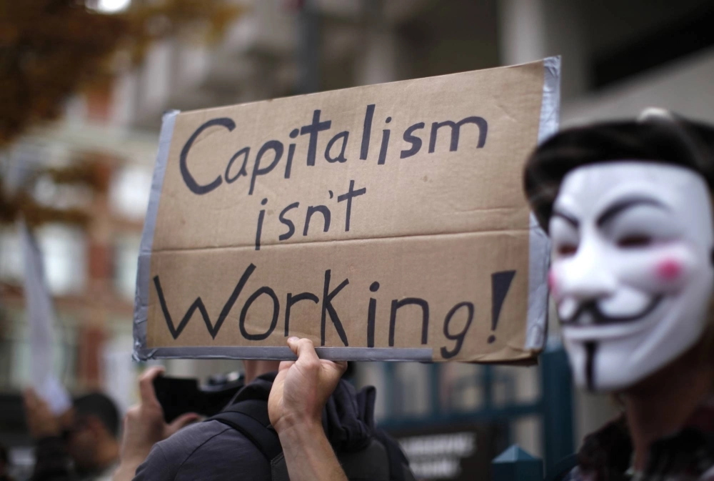 Occupy Wall Street protesters hold a rally in front of the U.S. Federal Reserve bank in downtown Denver in November 2011. Occupy Wall Street protesters hold a rally in front of the U.S. Federal Reserve bank in downtown Denver in November 2011.