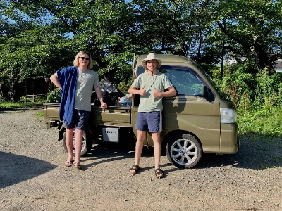 Blair Masters and Talisker Scott Hunter pose for a photo with their kei truck, nicknamed “KT,” outside Ebisu Circuit in Fukushima Prefecture. Blair Masters and Talisker Scott Hunter pose for a photo with their kei truck, nicknamed “KT,” outside Ebisu Circuit in Fukushima Prefecture.