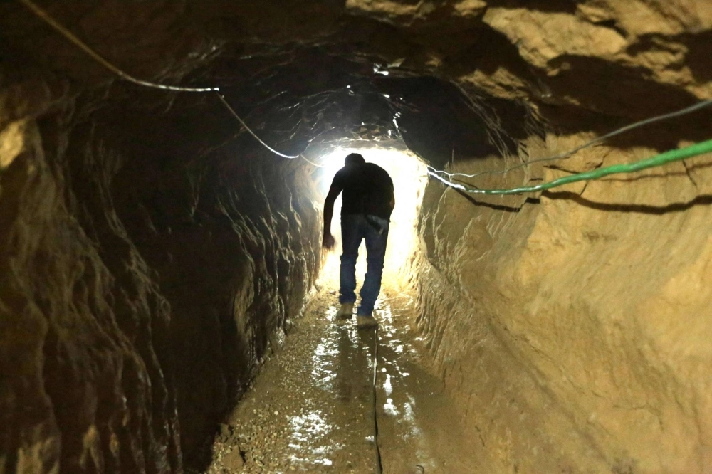 A Palestinian man walks in a tunnel linking the Gaza Strip to Egypt in 2012. The sprawling network of tunnels under the Gaza Strip has become a primary target for the Israeli military. A Palestinian man walks in a tunnel linking the Gaza Strip to Egypt in 2012. The sprawling network of tunnels under the Gaza Strip has become a primary target for the Israeli military.